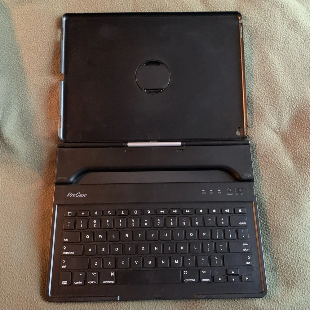FUC ProCase keyboard case for iPad Pro 12.9”. Black and silver. Charging cord.
